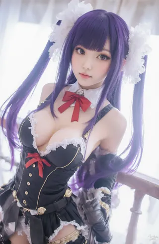 Cosplayer in elaborate purple and black outfit with red bow. Long hair tied back.